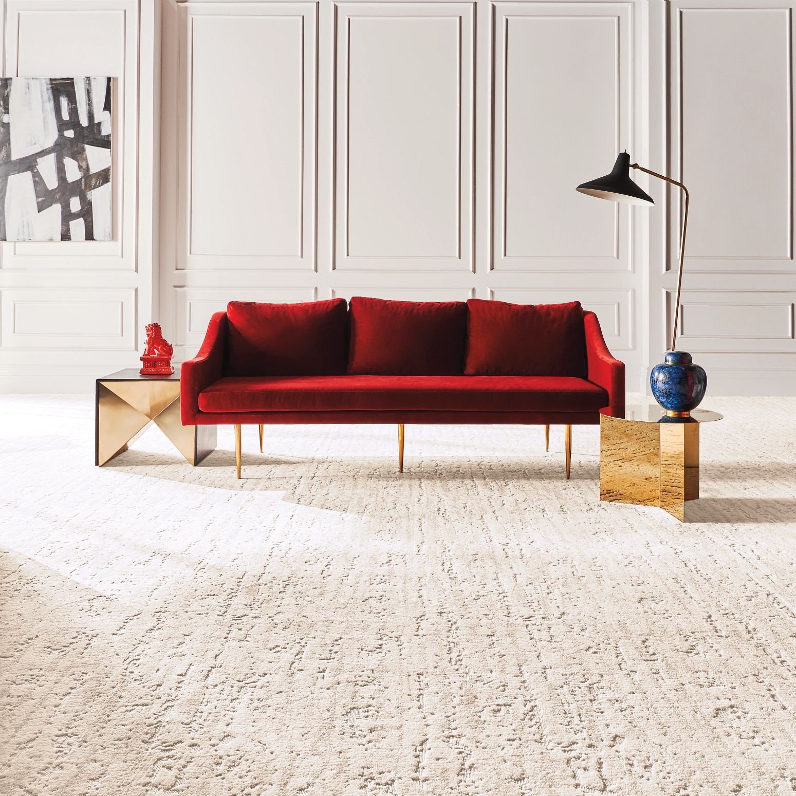 Bright living room with a red couch and beige carpet from Floors Of Wilmington in the Wilmington, NC area